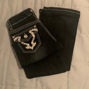 Dark blue bootcut jeans with rhinestone pockets